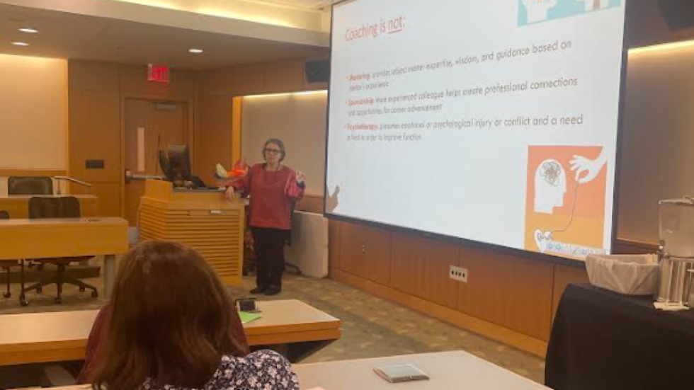 Person giving talk in classroom